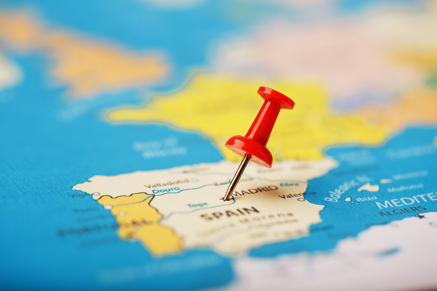 the-location-of-the-destination-on-the-map-of-spain-is-indicated-by-red-pushpin-spain-marked-on-the-map-with-red-button